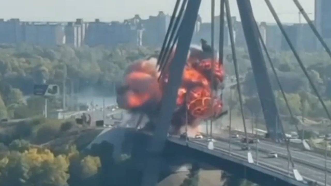Moment Russian drone hits bridge in Ukraine's Kyiv