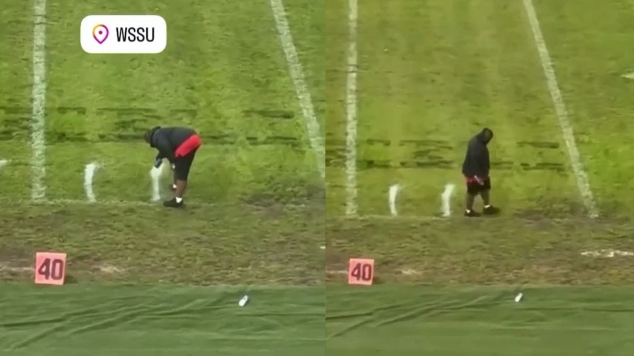 Line painter spotted measuring yardage lines with feet